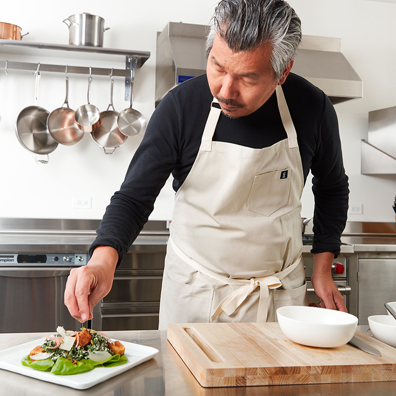 chef bill kim preparing kale salad